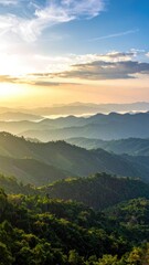 Golden sunrise over misty mountain ranges and lush, forested valleys