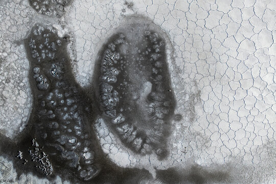 Abstract salt mud texture with cracked earth detail