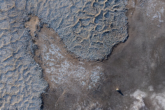 Aerial view of salt and mud textures on a flat surface