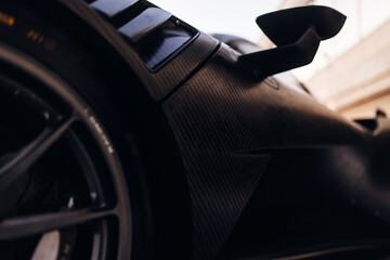 Carbon fender of racing car at the pitlane 