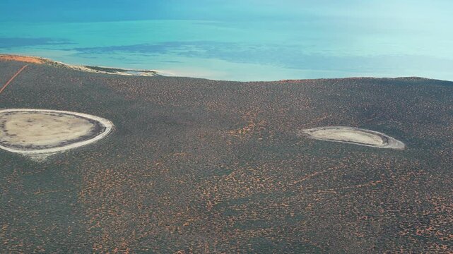 Aerial view of Francois Peron National Park coastline and red cliffs from airplane, Shark Bay, Western