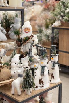 Festive Christmas toy store display with snowmen and Santa