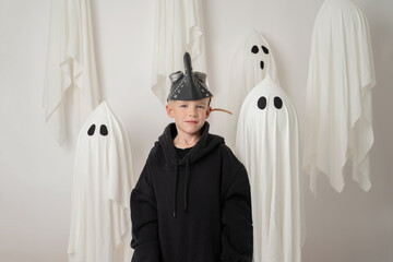 Child in costume surrounded by ghostly figures