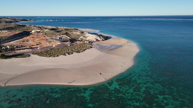 Aerial view of Coral Bay and beach in Western Australia with turquoise ocean and white sand - Powered by Adobe