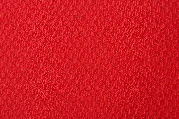Red fabric macro photo as background.