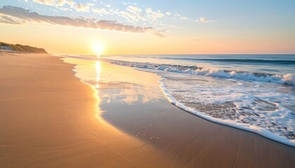 Golden Hour Beach Sunset Over Calm Ocean Waters Reflecting Soft Sunlight and Wispy Clouds on Wet Sand with Gentle Waves