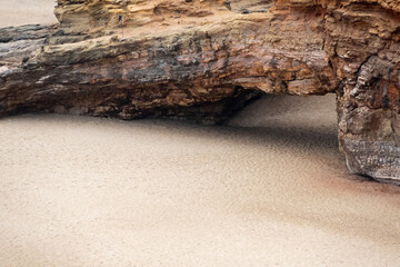 view of ocean beach, with rock, in Nazarè, Portugal