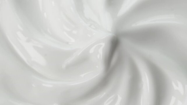 Creamy Swirl: A close-up view unveils a luxurious, creamy texture, its surface artfully sculpted into a mesmerizing swirl that exudes a sense of smooth elegance and sensory pleasure.