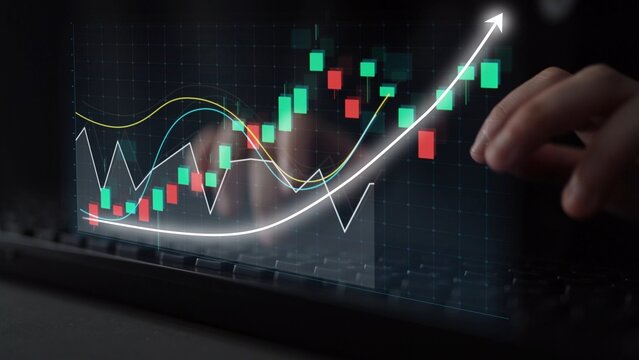 A close-up view of hands interacting with a digital financial chart that illustrates an upward trend, showcasing data analysis in a modern office environment. Copula