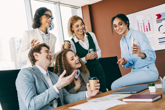 Diverse group of business professionals collaborating in a modern office space promoting teamwork