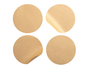 Four tan stickers, two peeled back. Circular. Plain