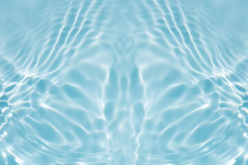 Blue water with ripples on the surface. Defocus blurred transparent blue colored clear calm water surface texture with splashes and bubbles. Water waves with shining pattern texture background.