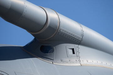 Close-up of the base section of a refueling probe where it attaches to the aircraft fuselage, showing structural panels and rivets