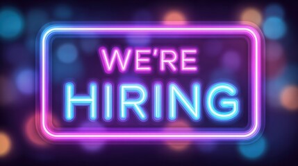 A vibrant neon sign displays the message Were Hiring in bright colors. The background features a soft blur of colorful lights, creating a lively and engaging mood.