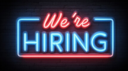 A vibrant neon sign displays the message Were Hiring in blue and red lights, attracting potential job seekers. This eye-catching display is perfect for businesses looking to fill positions.