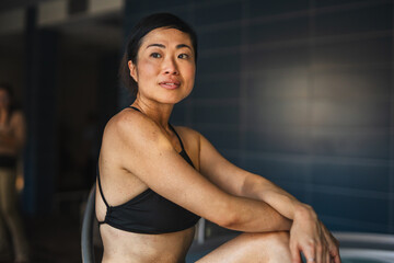 Asian woman relaxing at a spa wellness center