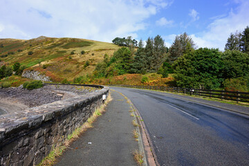 Road crossing Bwlch-y-gle dam on side valley at Llyn Clywedog in central Wales