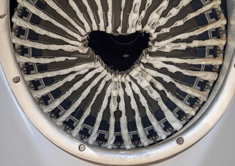 Close-up of turboprop engine exhaust with visible internal structure and protective fabric elements arranged radially inside nacelle housing