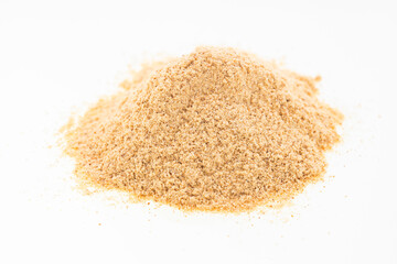 Pile of organic maca powder on a white background - Lepidium meyenii