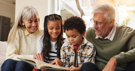 Happy, reading and grandparents with children on sofa for bonding, learning together and knowledge....