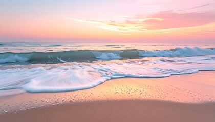 Ocean wave with gentle foam rolling onto a sandy beach during a pastel pink and orange sunset with reflections on the wet sand