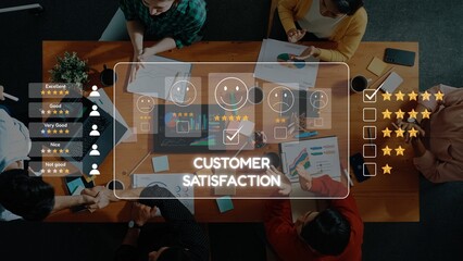 A diverse group of individuals engages in a discussion about customer satisfaction, analyzing charts and feedback metrics displayed on a laptop at a modern office table. Raster