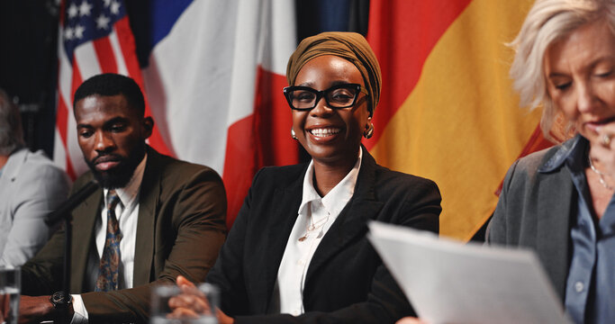 Press conference, politics and happy woman with government panel or international delegation. Summit, people and portrait of politician with group at event for diplomacy, global forum or policy expo