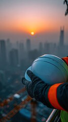 Construction Worker Holding Safety Helmet At Sunrise City View