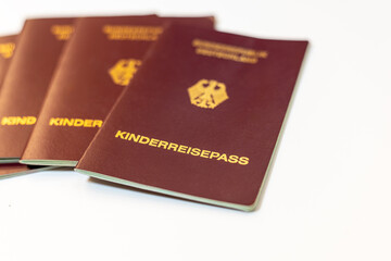 Group of German children's passports lying on a table ready for family travel plans