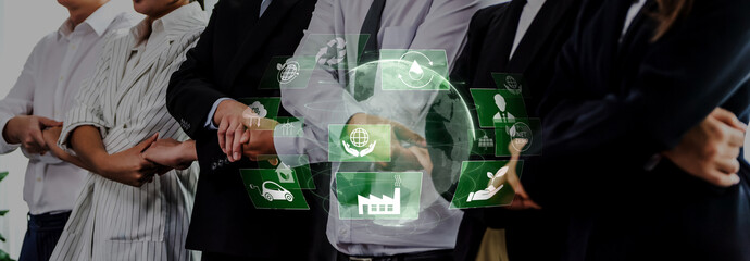 A diverse business team stands united with arms crossed, symbolizing collaboration and innovation...