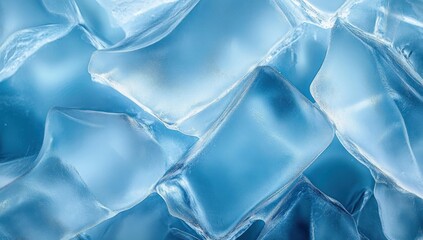 Close-up of translucent blue ice cubes with smooth and textured surfaces reflecting light