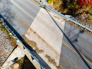 Aerial drone view of a road and bridge. 