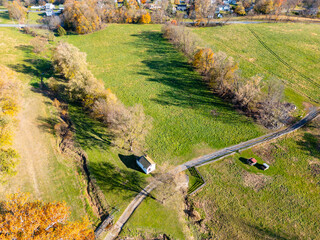 A farm and farmhouse during sunset. Aerial drone. 