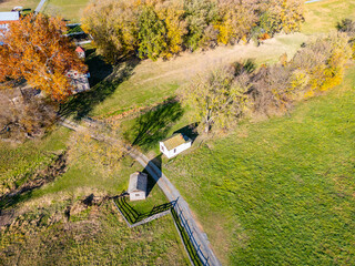 A farm and farmhouse during sunset. Aerial drone. 