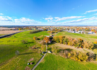 A farm and farmhouse during sunset. Aerial drone. 