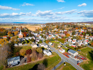 Aerial drone view of a town during fall. 