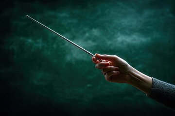 Fototapeta premium Aged Hand Holding Wand In Dramatic Lighting