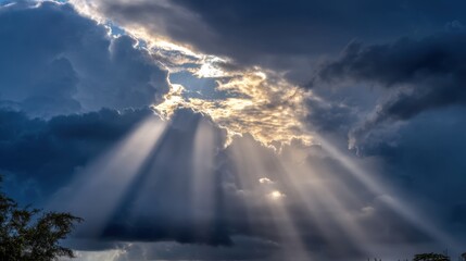Dramatic Sky with Sunbeams Breaking Through Dark Clouds Illuminating the Atmosphere and Creating an Awe-Inspiring Natural Wonderland