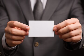 Businessman Holding Blank Business Card In Gray Suit