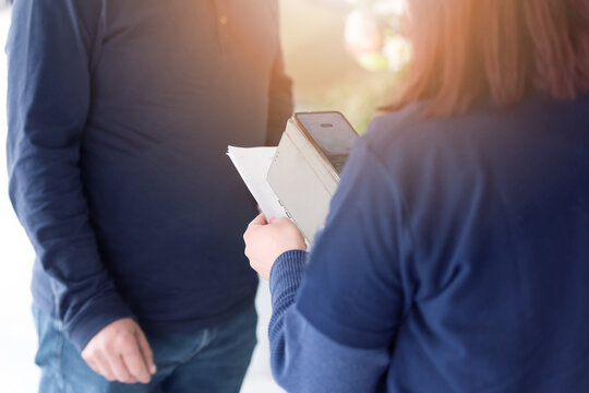 Close-up of woman scanning QR code with smartphone for digital payment or online registration