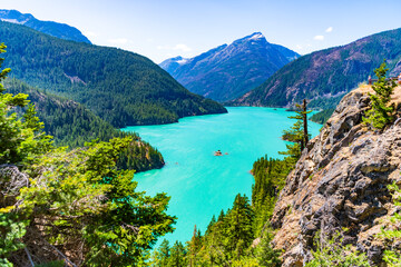 Scenic nature view over Diablo lake. Diablo lake with mountain landscape. Landscape of mountain peak and Diablo lake. Nature landscape. Diablo Lake in North Cascades Park. Turquoise alpine water