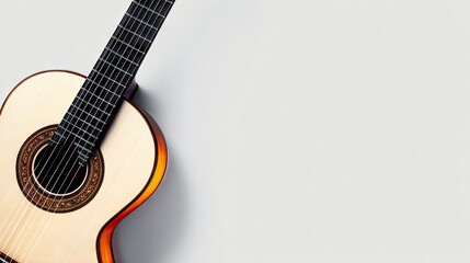 Obraz premium Classical guitar resting on white background with copy space for music themes