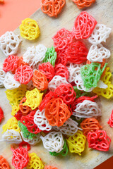 Crackers, cuanki, noodles, and complete dry seblak seasoning on a wooden tray