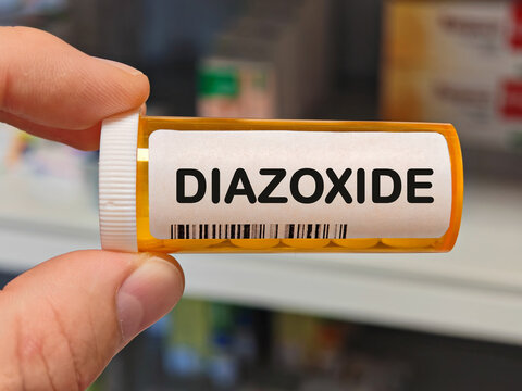 Box of DIAZOXIDE tablets on a hospital pharmacy table used to treat hypoglycemia a potassium channel activator.