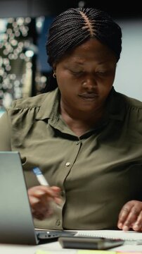 Vertical Video Corporate employee ripping and breaking textbook paper after writing something wrong, making a mistake due to workload and fatigue after hours. Writing a detailed report and making a