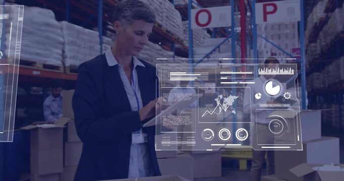 Manager tapping tablet in packing area, bringing up HUD charts while team updating inventory
