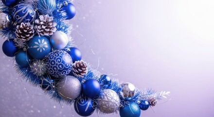 Blue and silver christmas ornament display with pinecones