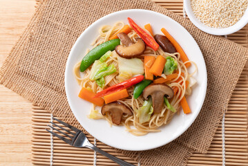 Vegetarian stir fried noodles with mushroom and vegetables with soy sauce, Asian food style
