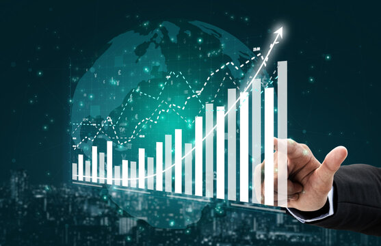 A businessman reaches out towards a striking digital graph illustrating financial growth trends against a world map backdrop, symbolizing global business success. Impute