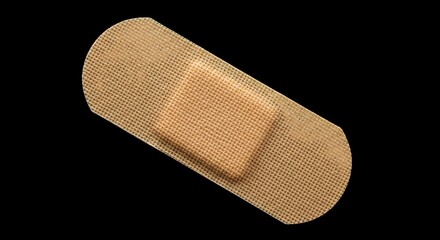 Adhesive bandage on black background for wound care